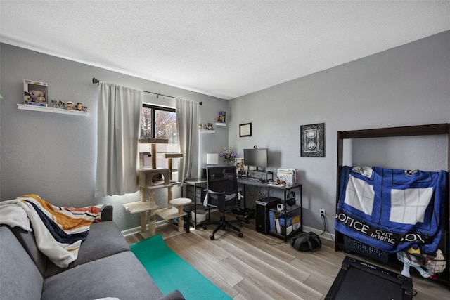 849 Kerry Ln SE Unit 49, Cedar Rapids, IA 52403 - office with wood finished floors, a textured ceiling, and baseboards
