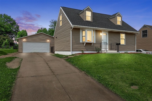 5208 Gordon Ave NW, Cedar Rapids, IA 52405 - cape cod home with a garage, an outbuilding, a front yard, and a shingled roof