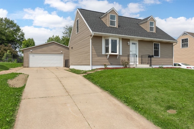 5208 Gordon Ave NW, Cedar Rapids, IA 52405 - cape cod home featuring a detached garage, an outbuilding, a front lawn, and a shingled roof