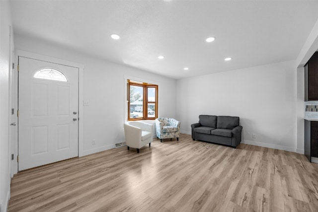 5208 Gordon Ave NW, Cedar Rapids, IA 52405 - foyer entrance with healthy amount of natural light, light wood-style flooring, recessed lighting, and baseboards