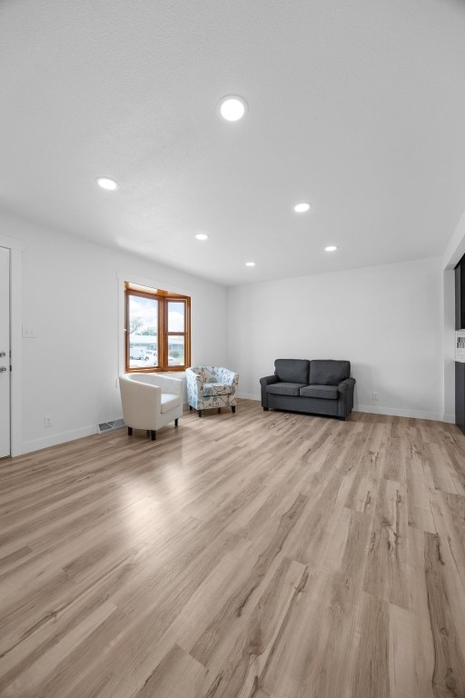 5208 Gordon Ave NW, Cedar Rapids, IA 52405 - living area with light wood-style flooring, recessed lighting, and baseboards