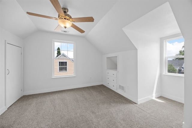 5208 Gordon Ave NW, Cedar Rapids, IA 52405 - bonus room featuring carpet flooring, lofted ceiling, ceiling fan, and baseboards