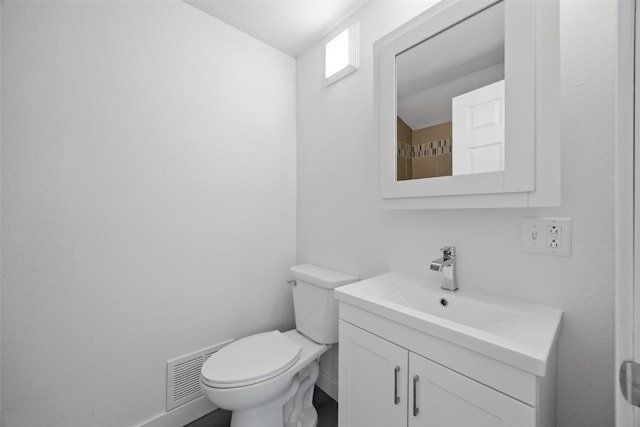 5208 Gordon Ave NW, Cedar Rapids, IA 52405 - bathroom with vanity, toilet, and baseboards