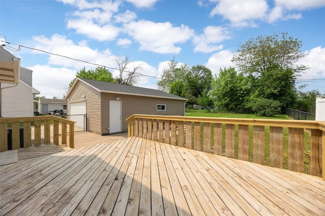 5208 Gordon Ave NW, Cedar Rapids, IA 52405 - wooden deck featuring a garage and an outdoor structure