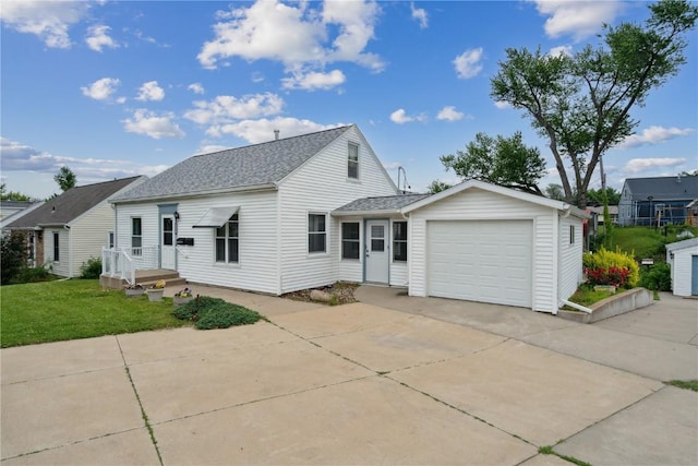 2241 Williams Blvd SW, Cedar Rapids, IA 52404 - traditional home with concrete driveway, an attached garage, a shingled roof, and a front yard