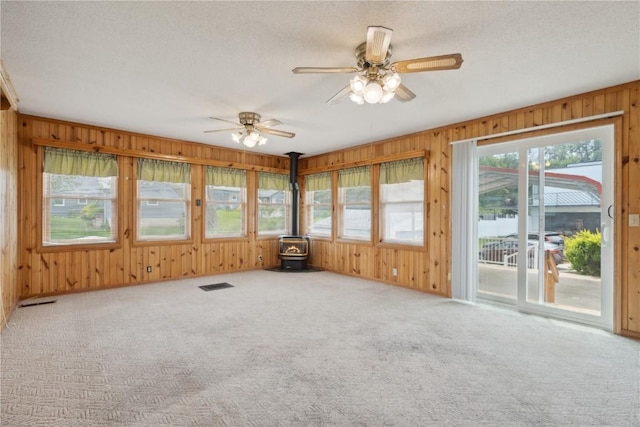 2241 Williams Blvd SW, Cedar Rapids, IA 52404 - unfurnished sunroom with a wood stove