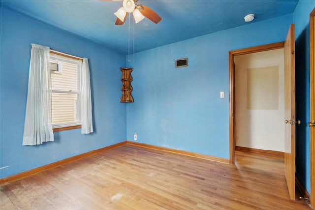 2241 Williams Blvd SW, Cedar Rapids, IA 52404 - spare room with ceiling fan, wood finished floors, baseboards, and a smoke detector