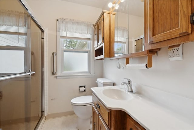 2241 Williams Blvd SW, Cedar Rapids, IA 52404 - full bath with toilet, vanity, a stall shower, and tile patterned flooring