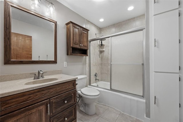 2820 12th Ave SW, Cedar Rapids, IA 52404 - bathroom with toilet, vanity, shower / bath combination with glass door, and tile patterned floors