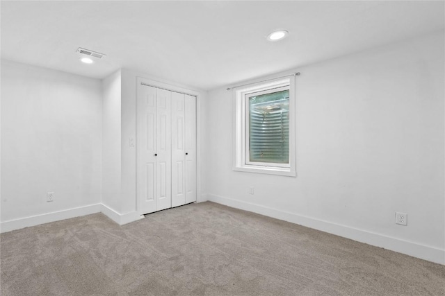 2820 12th Ave SW, Cedar Rapids, IA 52404 - unfurnished bedroom with carpet, baseboards, recessed lighting, and a closet