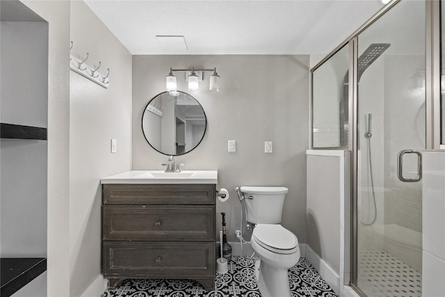 2820 12th Ave SW, Cedar Rapids, IA 52404 - bathroom with vanity, toilet, baseboards, a stall shower, and tile patterned flooring