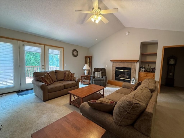 1037 Doubletree Ct NE, Cedar Rapids, IA 52402 - living area with light colored carpet, vaulted ceiling, a fireplace, ceiling fan, and a textured ceiling