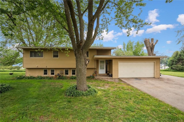 331 Lake View Dr NE, Solon, IA 52333 - split level home featuring an attached garage, a front yard, and concrete driveway