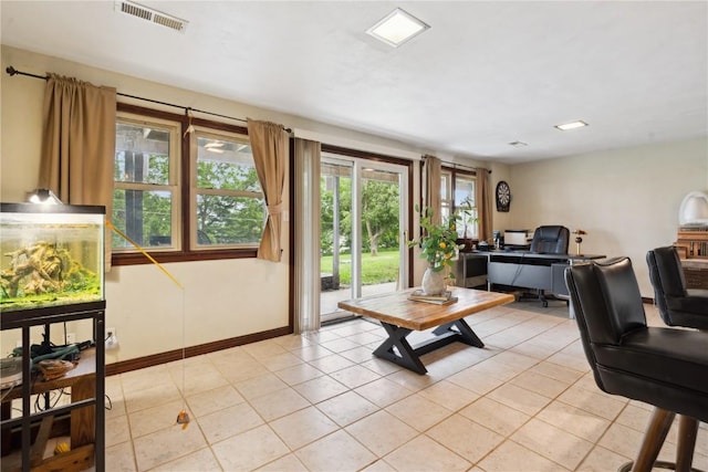 331 Lake View Dr NE, Solon, IA 52333 - living room featuring an office area, light tile patterned floors, and baseboards