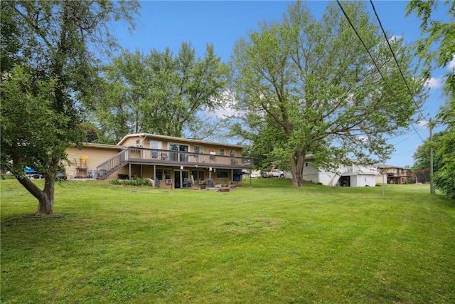 331 Lake View Dr NE, Solon, IA 52333 - view of green lawn featuring a deck and stairs