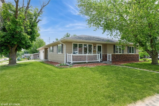 3099 27th Ave, Marion, IA 52302 - ranch-style home with a porch, a front lawn, and a garage