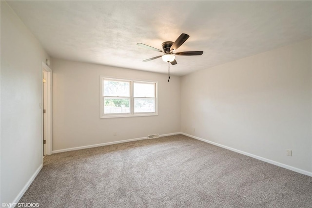 3099 27th Ave, Marion, IA 52302 - carpeted empty room featuring a ceiling fan and baseboards