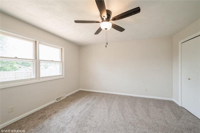 3099 27th Ave, Marion, IA 52302 - carpeted empty room with a ceiling fan and baseboards
