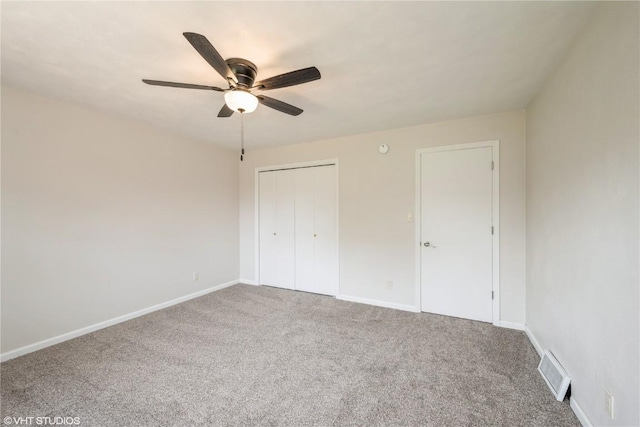 3099 27th Ave, Marion, IA 52302 - unfurnished bedroom with carpet flooring, baseboards, a closet, and ceiling fan