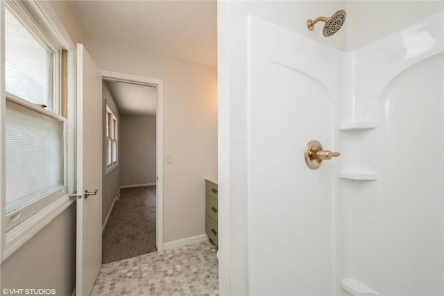 3099 27th Ave, Marion, IA 52302 - bathroom with a shower, vanity, and baseboards