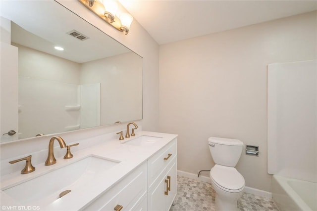 3099 27th Ave, Marion, IA 52302 - bathroom with double vanity, baseboards, and toilet