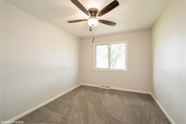 3099 27th Ave, Marion, IA 52302 - unfurnished room featuring dark carpet, baseboards, and a ceiling fan