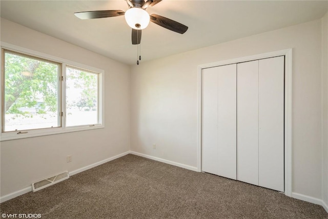 3099 27th Ave, Marion, IA 52302 - unfurnished bedroom featuring carpet floors, baseboards, a closet, and a ceiling fan