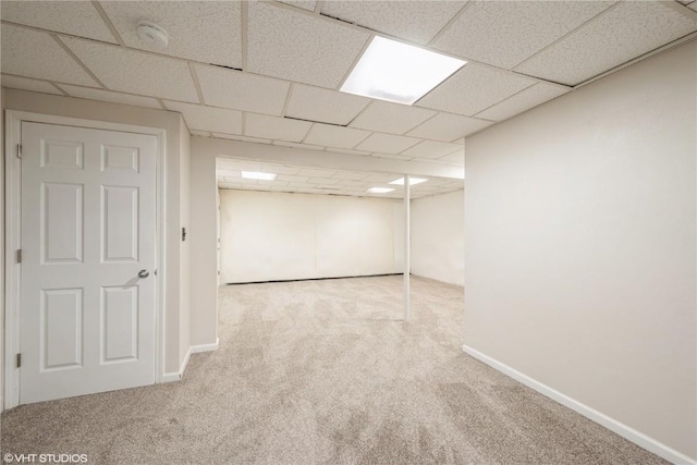3099 27th Ave, Marion, IA 52302 - finished below grade area with carpet floors, a paneled ceiling, and baseboards
