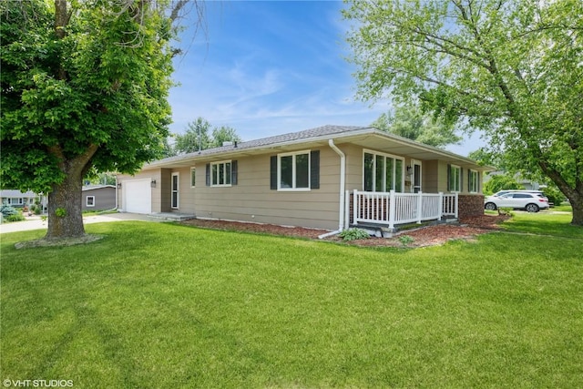 3099 27th Ave, Marion, IA 52302 - view of front of house featuring a front lawn, a garage, a porch, and driveway