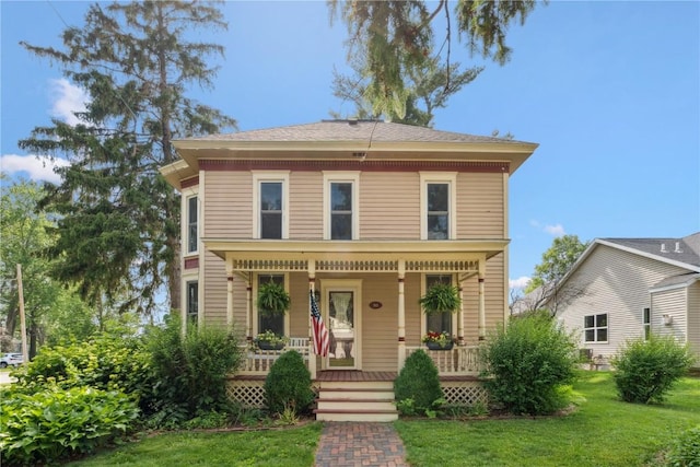 503 N Washington St, Lisbon, IA 52253 - view of front of property featuring a porch and a front yard
