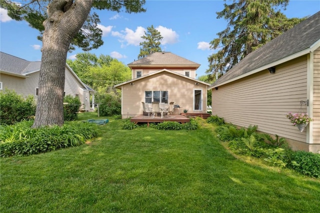 503 N Washington St, Lisbon, IA 52253 - back of house with a lawn and a deck