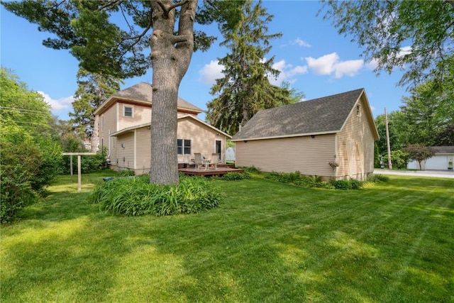 503 N Washington St, Lisbon, IA 52253 - back of property featuring a deck and a yard