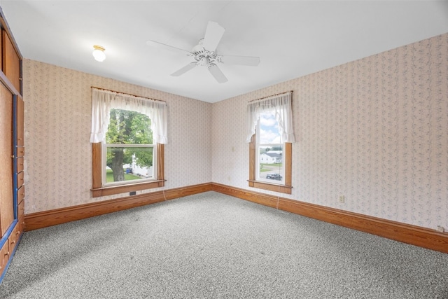 502 5th Ave, Clarence, IA 52216 - unfurnished room with carpet flooring, plenty of natural light, ceiling fan, and baseboards