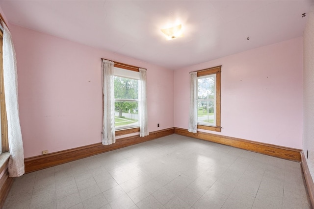 502 5th Ave, Clarence, IA 52216 - unfurnished room featuring baseboards and tile patterned floors