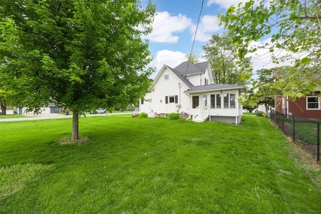 502 5th Ave, Clarence, IA 52216 - view of front facade with entry steps and a sunroom
