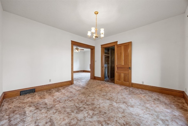 502 5th Ave, Clarence, IA 52216 - empty room featuring a chandelier, baseboards, and carpet floors