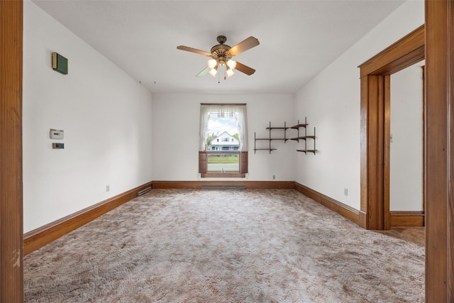 502 5th Ave, Clarence, IA 52216 - carpeted empty room featuring ceiling fan and baseboards