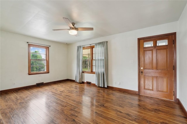 722 47th Ave, Amana, IA 52203 - unfurnished room with a ceiling fan, wood finished floors, and baseboards