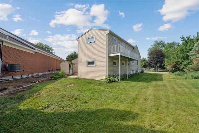 722 47th Ave, Amana, IA 52203 - back of property with a balcony and central air condition unit