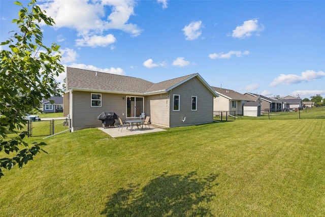 2106 Shady Grove Rd SW, Cedar Rapids, IA 52404 - back of house with a gate, a patio, and a shingled roof