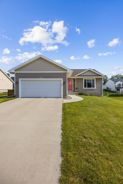 2106 Shady Grove Rd SW, Cedar Rapids, IA 52404 - ranch-style home featuring concrete driveway, a garage, and a front yard