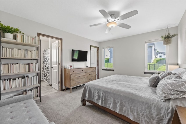 2106 Shady Grove Rd SW, Cedar Rapids, IA 52404 - carpeted bedroom with ceiling fan and connected bathroom