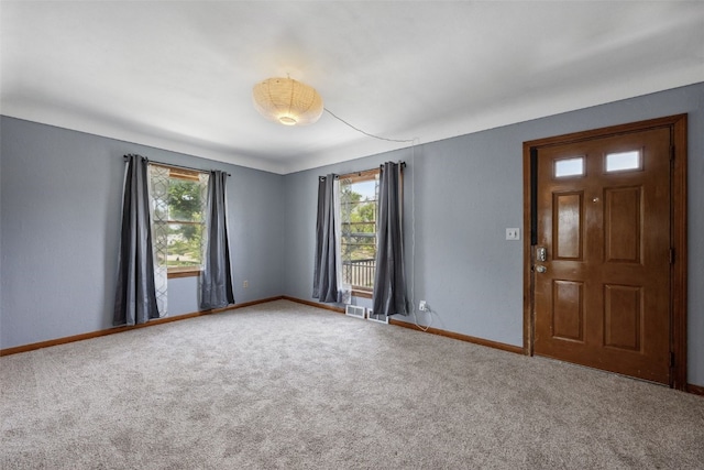 331 36th St NE, Cedar Rapids, IA 52402 - carpeted empty room with plenty of natural light and baseboards