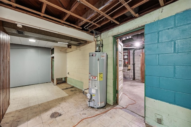 331 36th St NE, Cedar Rapids, IA 52402 - unfinished below grade area with water heater, tile patterned floors, and concrete block wall
