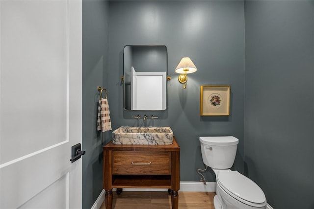 679 Allison Way, Iowa City, IA 52245 - half bathroom with vanity and wood finished floors