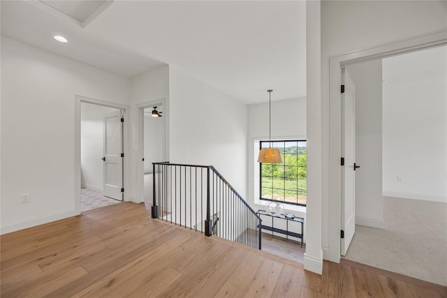 679 Allison Way, Iowa City, IA 52245 - hall featuring wood finished floors, an upstairs landing, and recessed lighting