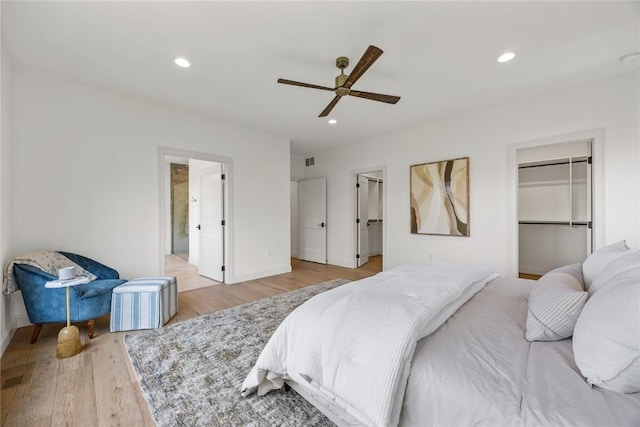679 Allison Way, Iowa City, IA 52245 - bedroom with a spacious closet, light wood finished floors, recessed lighting, a ceiling fan, and a closet