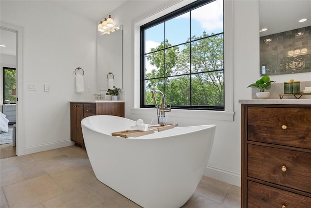 679 Allison Way, Iowa City, IA 52245 - full bathroom featuring vanity, a soaking tub, a tile shower, and recessed lighting