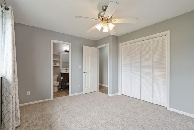 2445 Hillview Dr, Marion, IA 52302 - unfurnished bedroom featuring carpet, baseboards, a closet, and ensuite bathroom