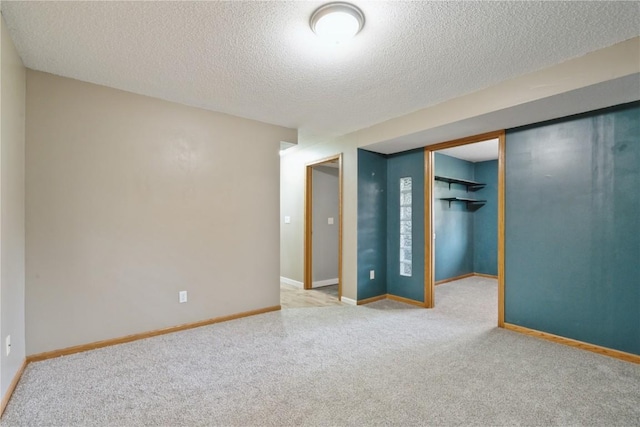 2445 Hillview Dr, Marion, IA 52302 - carpeted spare room with a textured ceiling and baseboards